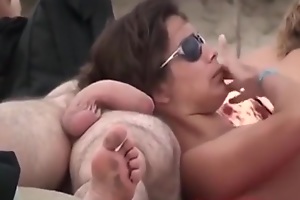 Voyeur tapes multiple nudist couples having sex at a nudist seaside