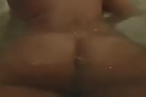 Mature playing in bath