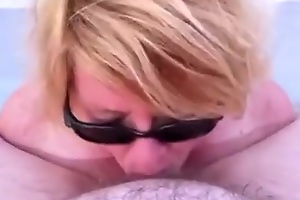Mature wife deepthroats out in the sun