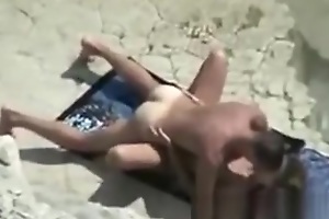 Voyeuring mom with her holiday lover at beach